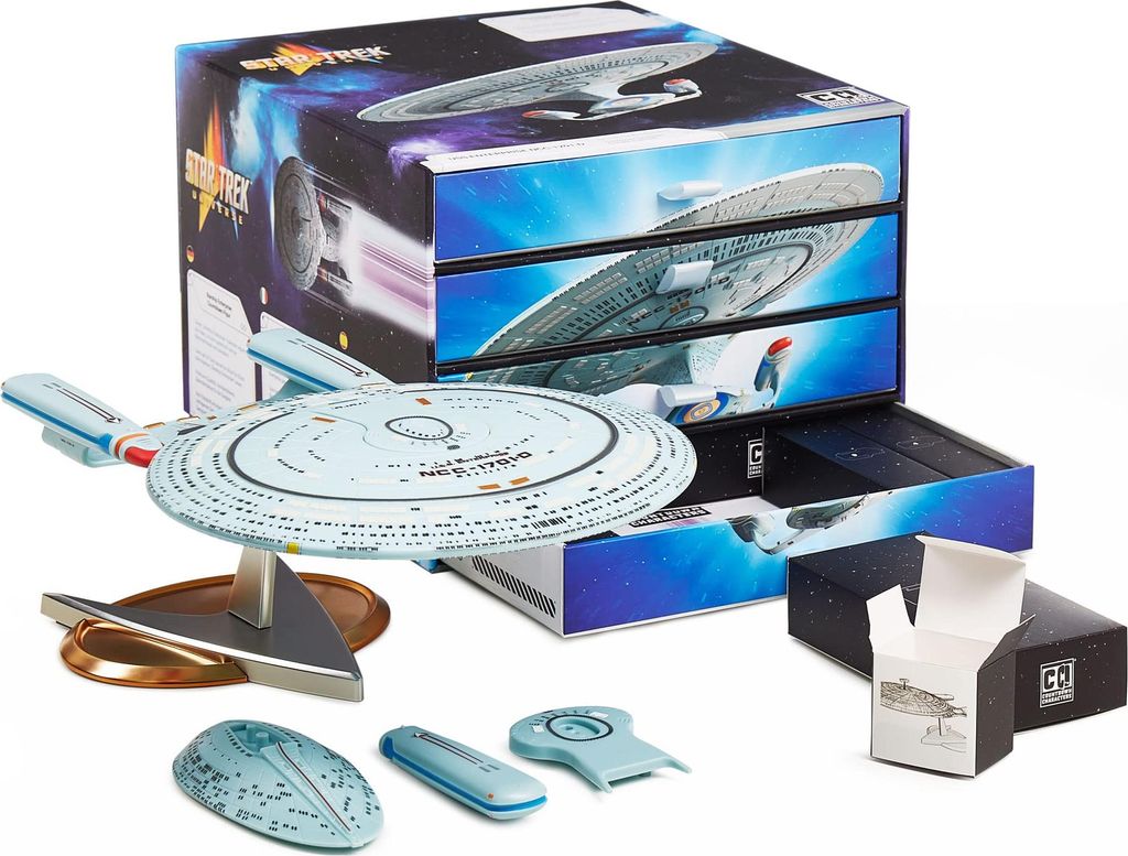 A Star Trek model kit and its packaging are displayed on a white background.
