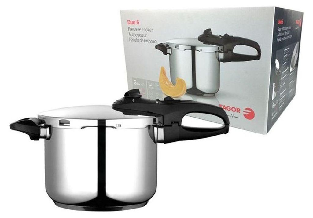 A stainless steel pressure cooker is shown in front of its packaging.
