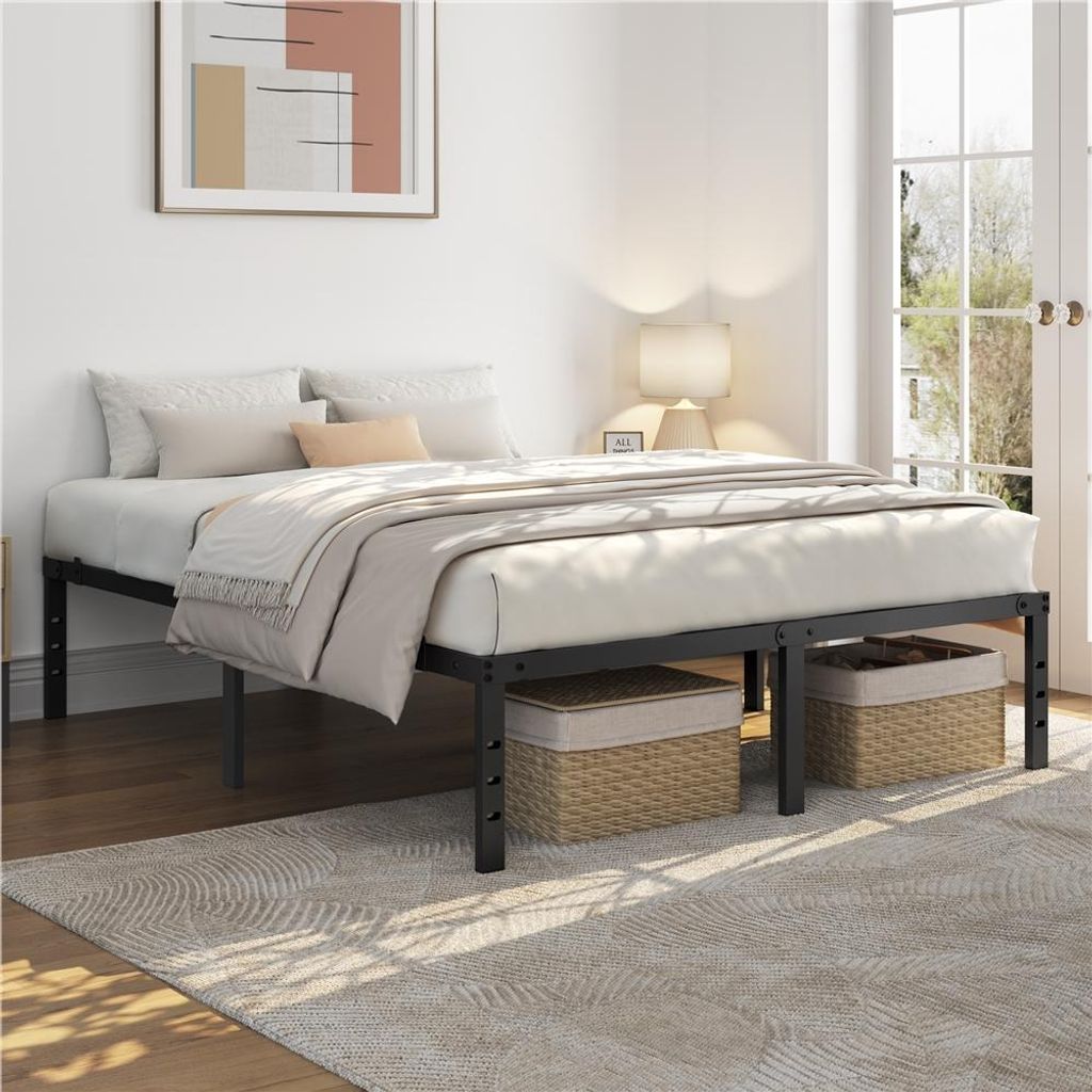 A bedroom scene with a bed frame and bedding.