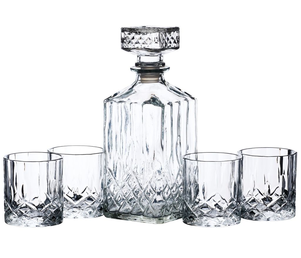 A clear studio shot of a crystal decanter and four matching glasses, arranged on a white background.