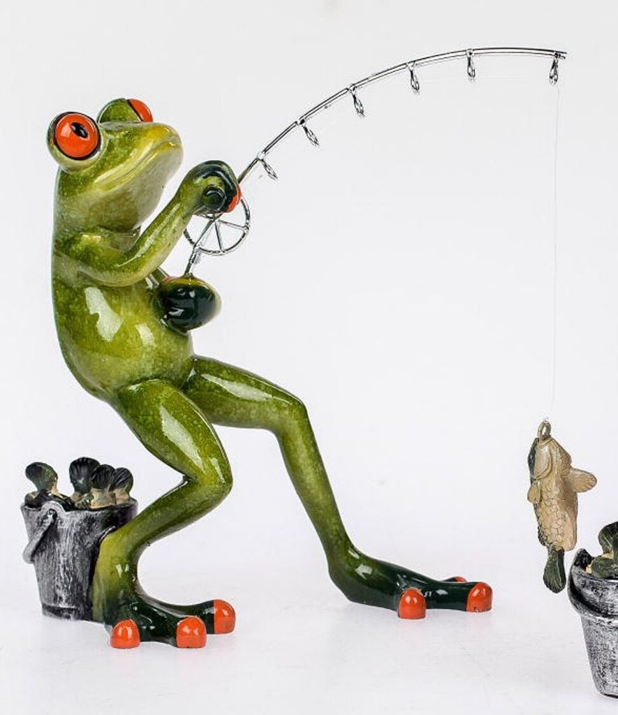 A decorative frog figurine is depicted fishing.