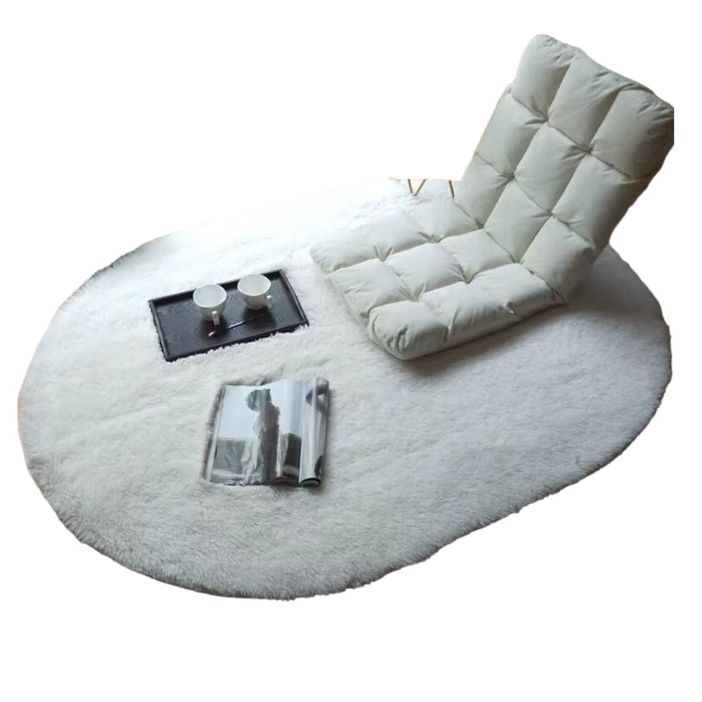 A white fluffy rug with a floor chair, a tray with two cups, and a magazine on it.