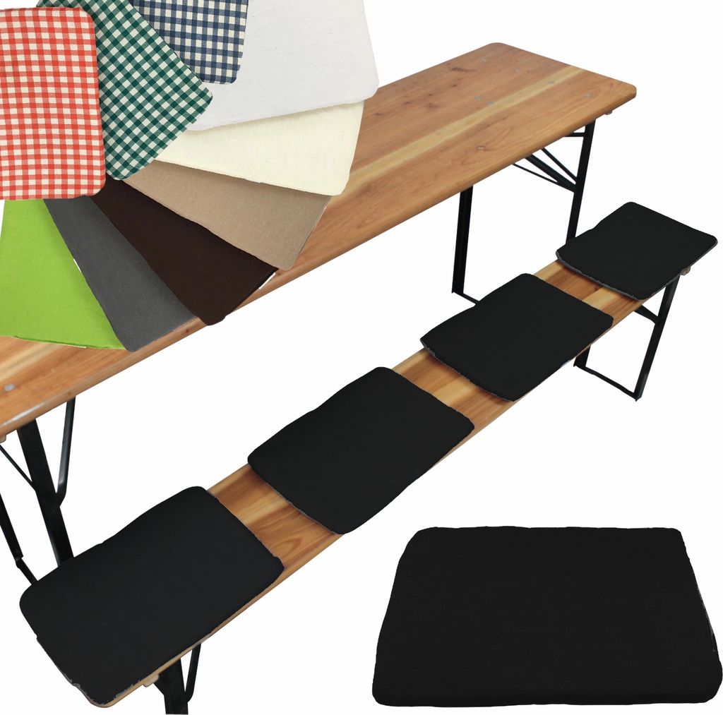 A collection of fabric swatches and black seat cushions displayed on and next to a wooden beer bench.