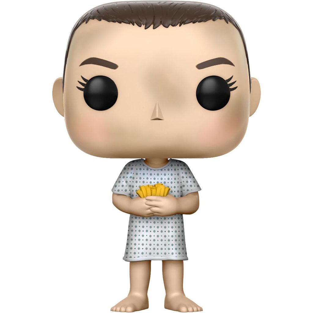 A Funko Pop! vinyl figure of Eleven from Stranger Things, wearing a hospital gown and holding a stack of waffles.