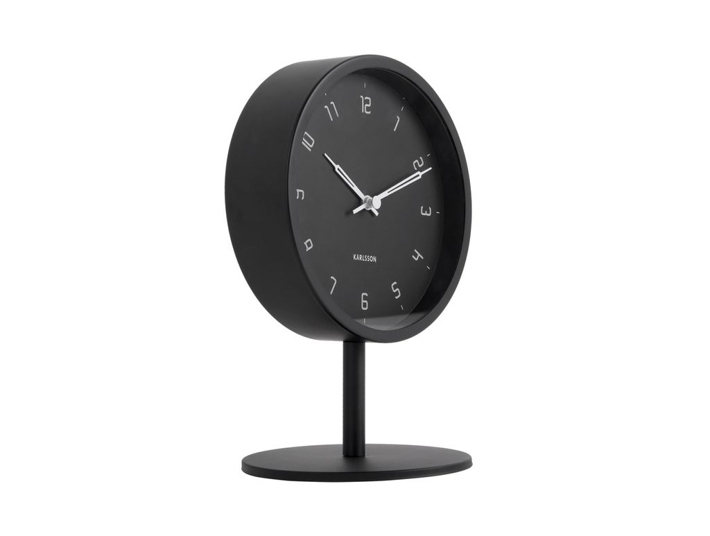 A black Karlsson Stark table clock on a white background.