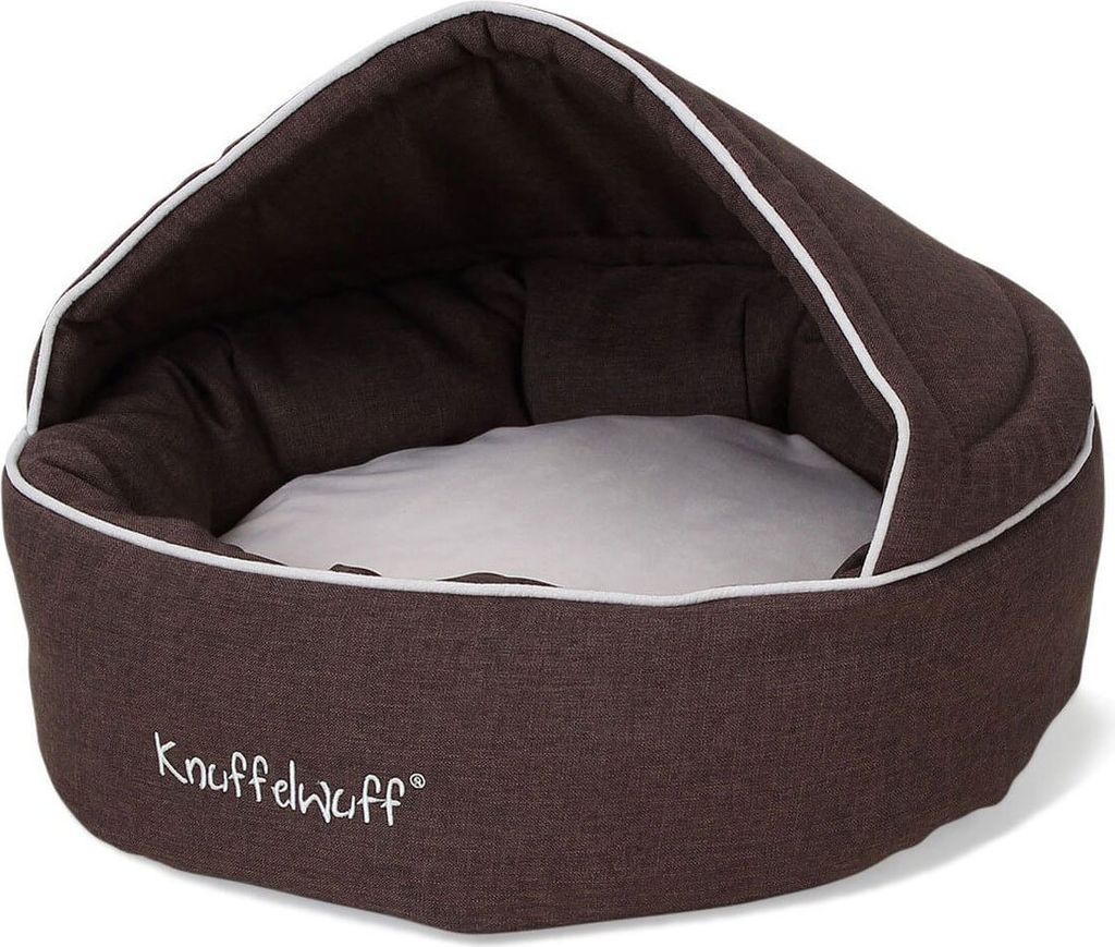 A brown pet bed with a white interior and trim, featuring a hooded design.