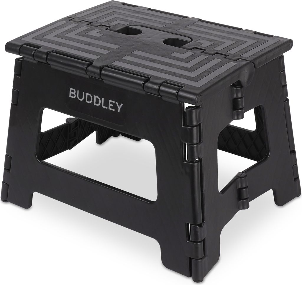 A black folding step stool.
