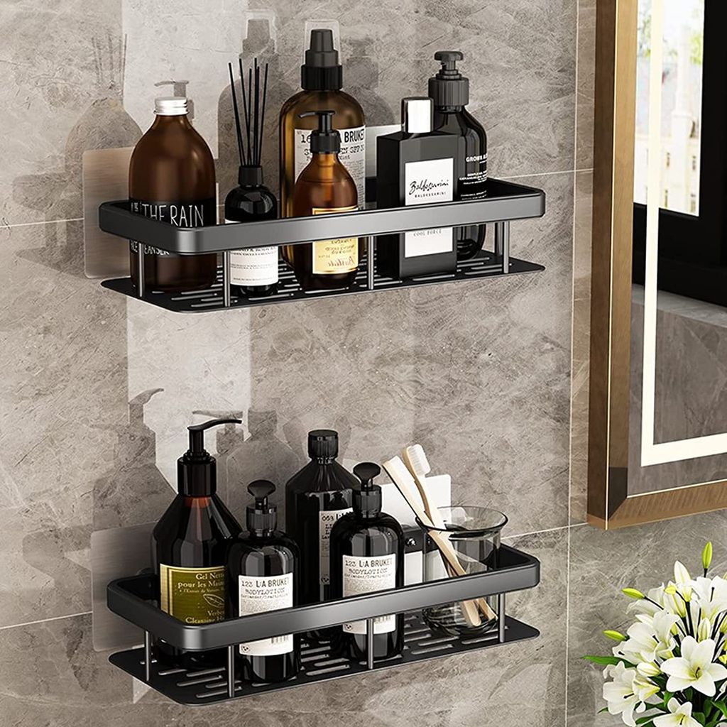 Two wall-mounted bathroom shelves filled with various toiletries and accessories, mounted on a tiled wall next to a mirror and flowers.