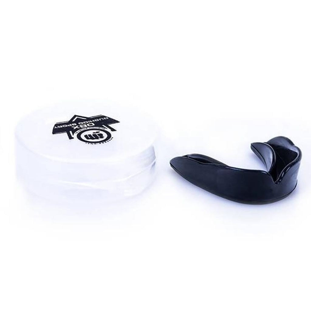 A black mouthguard and its white storage case are displayed on a white background.