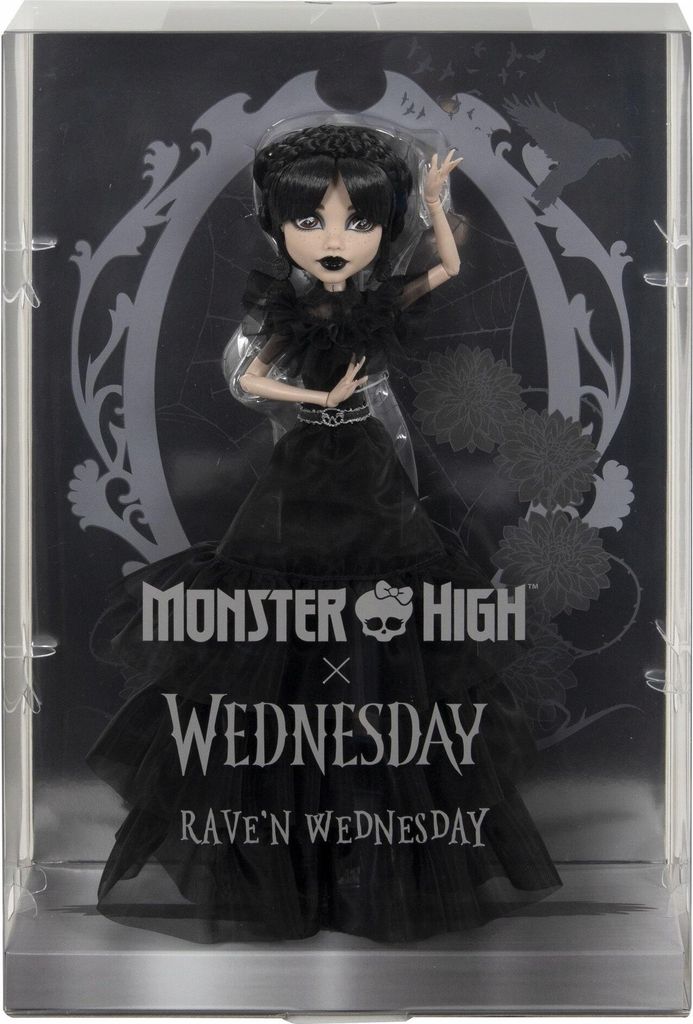 A doll in a black dress is displayed in its packaging, which has a gothic-themed background.