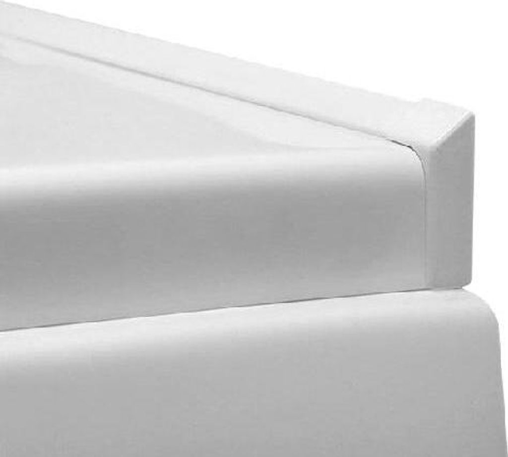 A close-up view of a white corner of a bathtub trim or similar product.