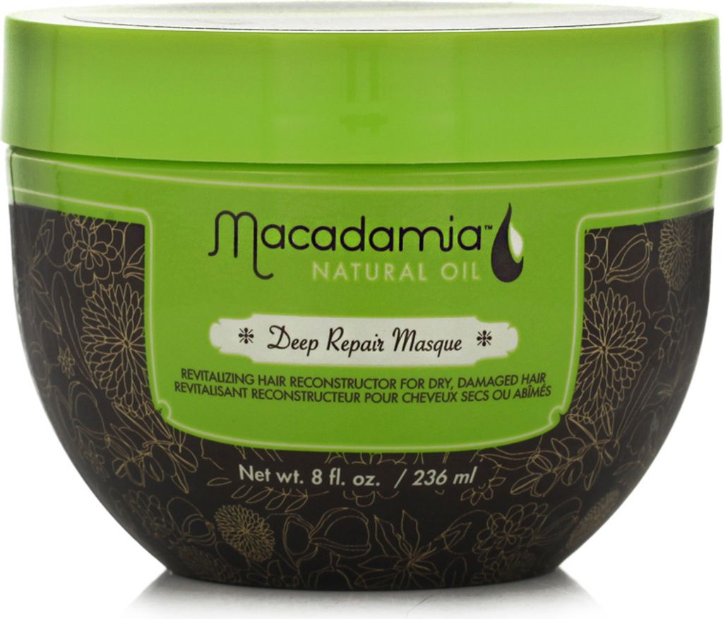 A product shot of a hair masque in a green and brown tub.
