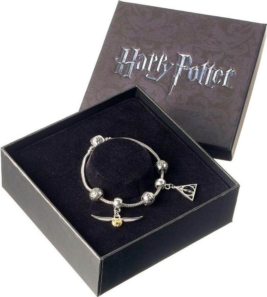A Harry Potter themed bracelet with charms is displayed in its open gift box.