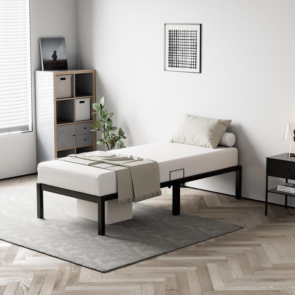 A bedroom scene with a bed, storage unit, and nightstand.