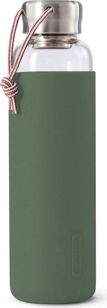 A glass water bottle with a green silicone sleeve and a rope handle.
