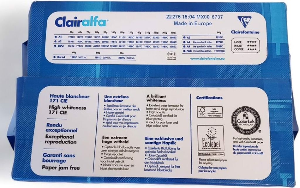 Two stacked reams of paper packaging, showing product details and certifications.