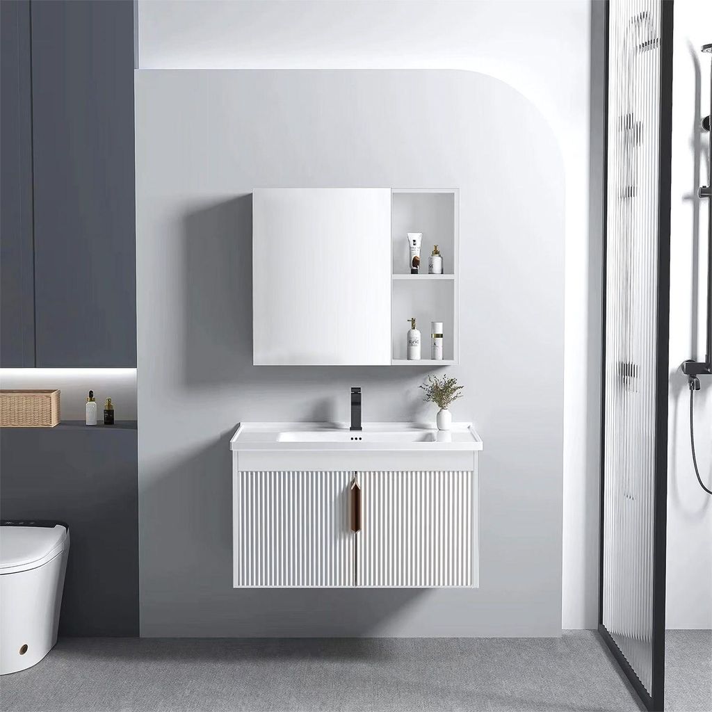 A modern bathroom vanity set with a sink and mirror, next to a toilet and shower.