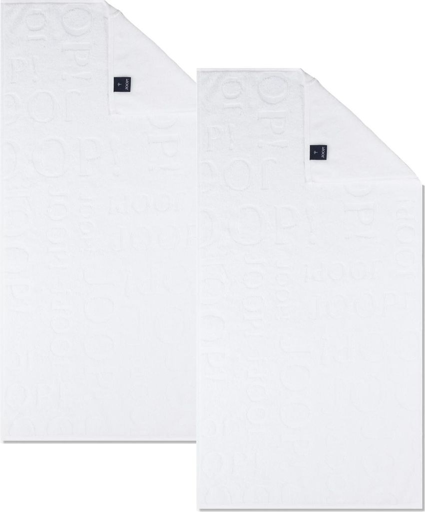 Two white towels are laid out on a white background.