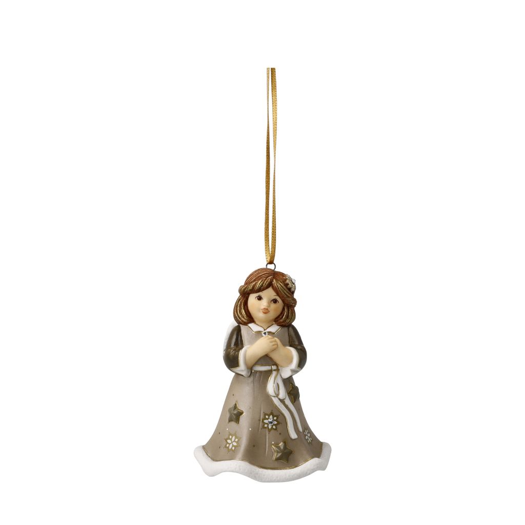 A ceramic Christmas ornament of a girl hanging from a gold ribbon.