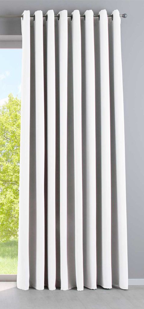 A white curtain hanging in front of a window.