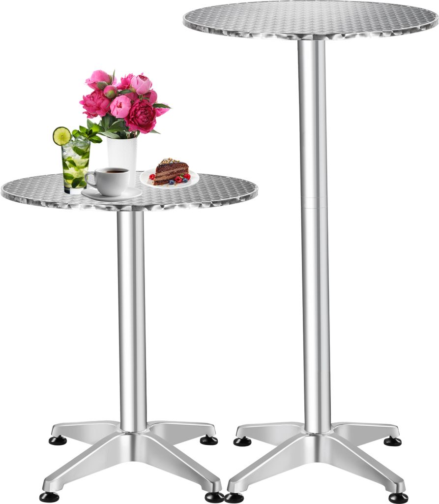 Two high-top tables, one with a drink, flowers and a slice of cake.
