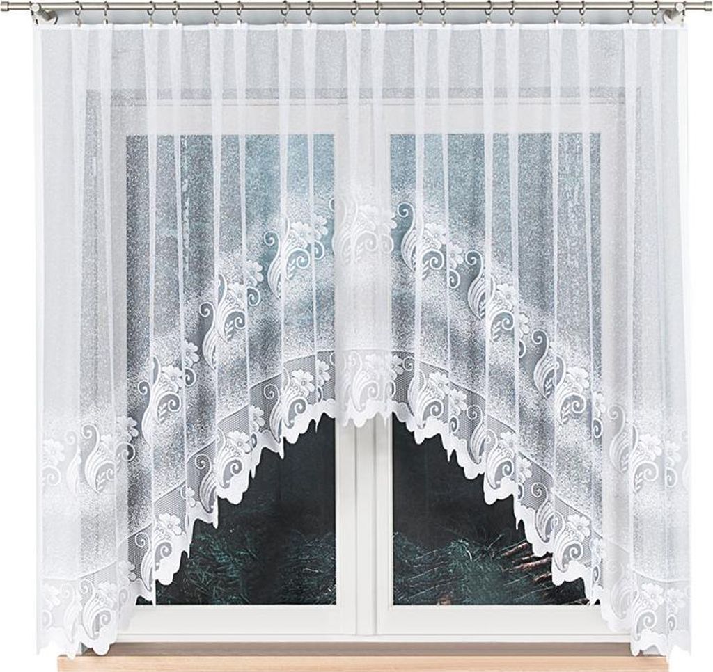 A white lace curtain with a scalloped bottom edge is shown hanging in front of a window.