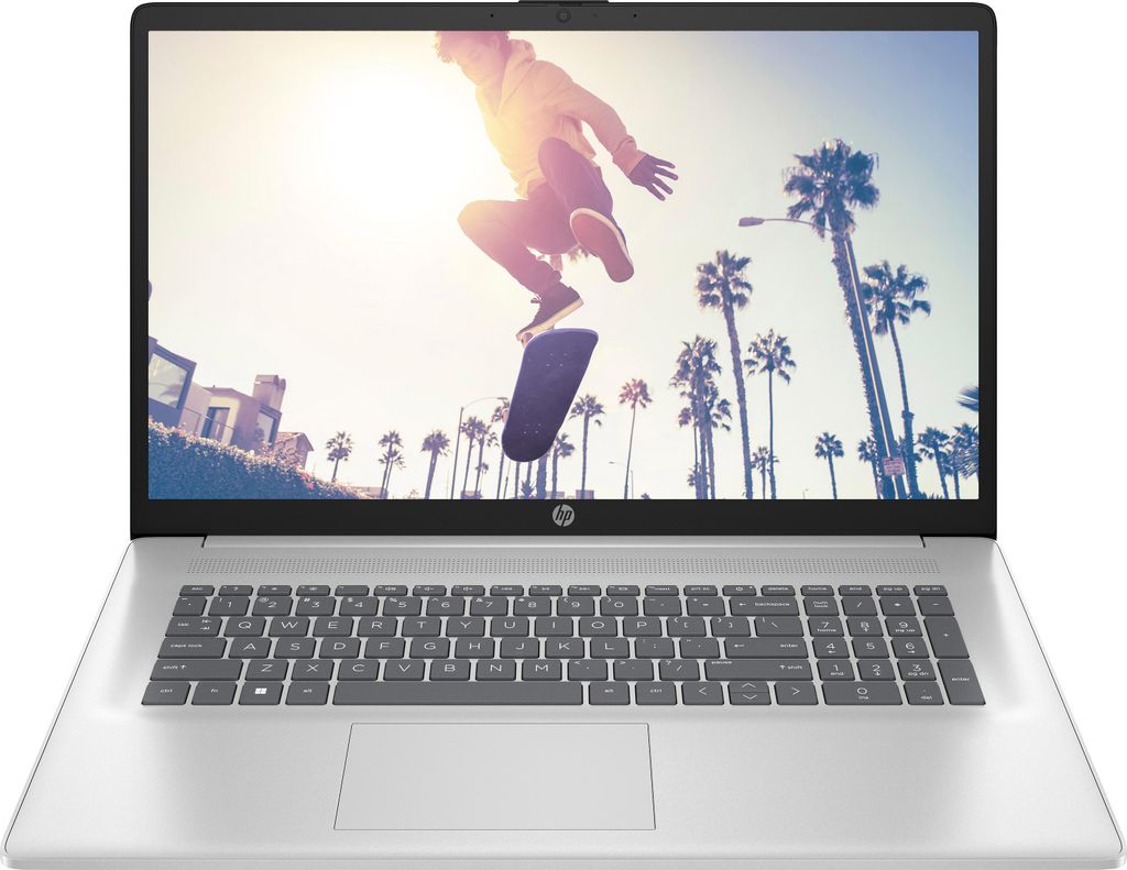 A laptop with a dynamic image of a skateboarder on the screen.