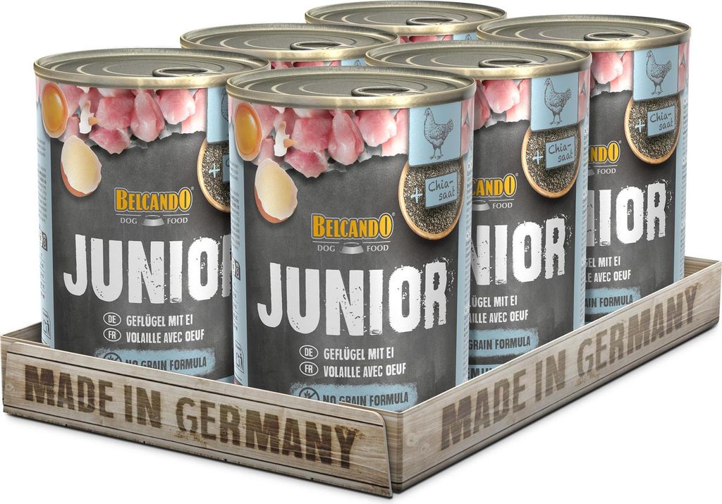 A six-pack of dog food cans in a wooden tray.