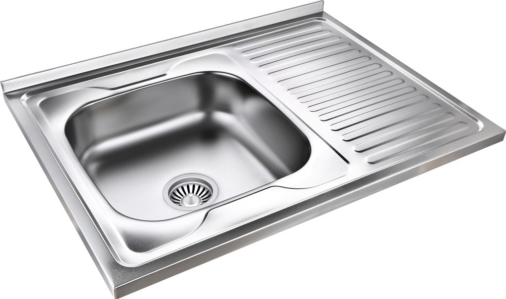 A stainless steel kitchen sink with a draining board.