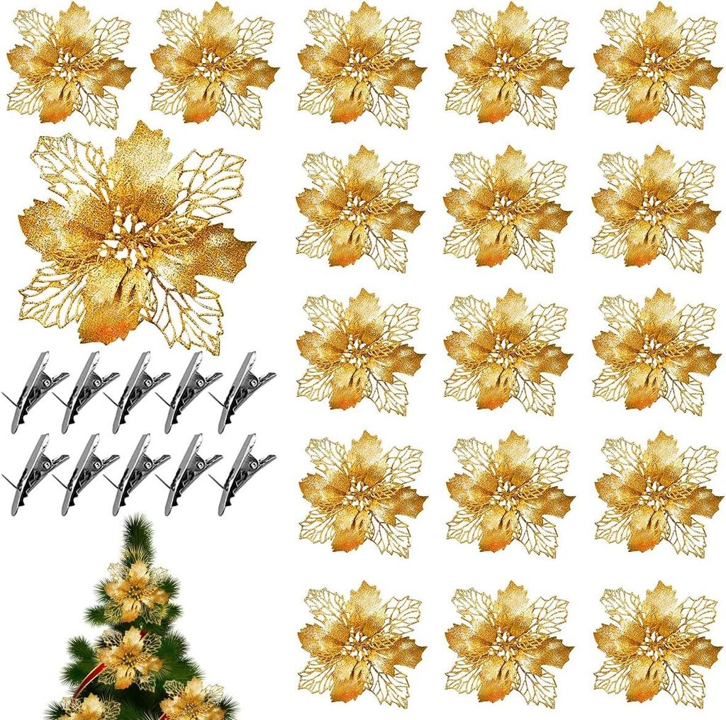 A collection of gold glitter poinsettia decorations and clips arranged on a white background, with a small section of a decorated Christmas tree in the bottom left corner.