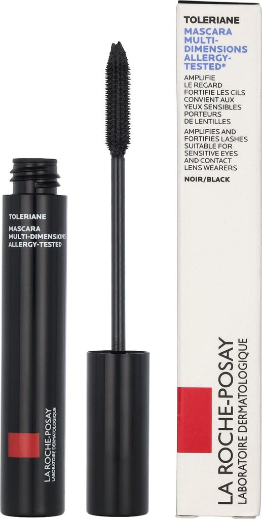 A black mascara tube and its applicator are shown next to its packaging.