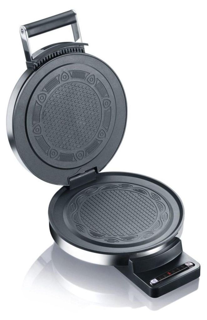 An open waffle maker with a patterned cooking surface.