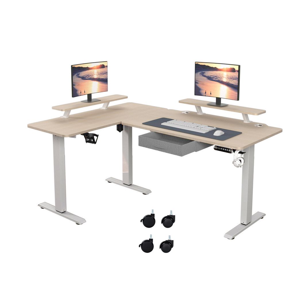 An L-shaped standing desk with two monitors on risers and a keyboard and mouse on a mat.