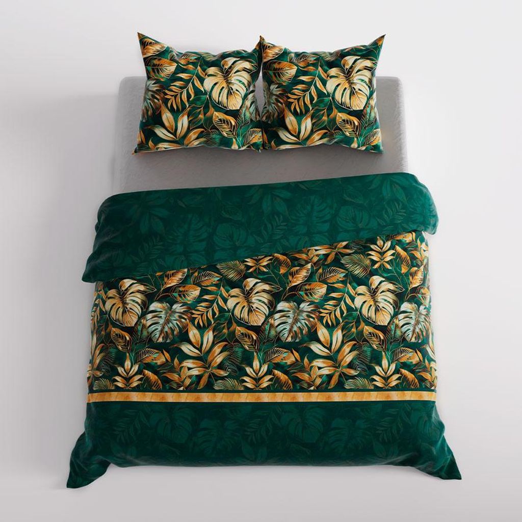 A duvet cover and pillow set laid out on a bed.