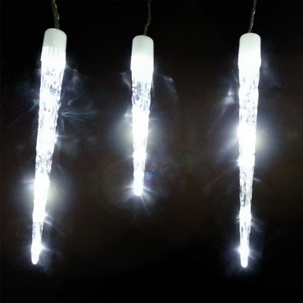 Three illuminated icicle-shaped lights hang against a black background.