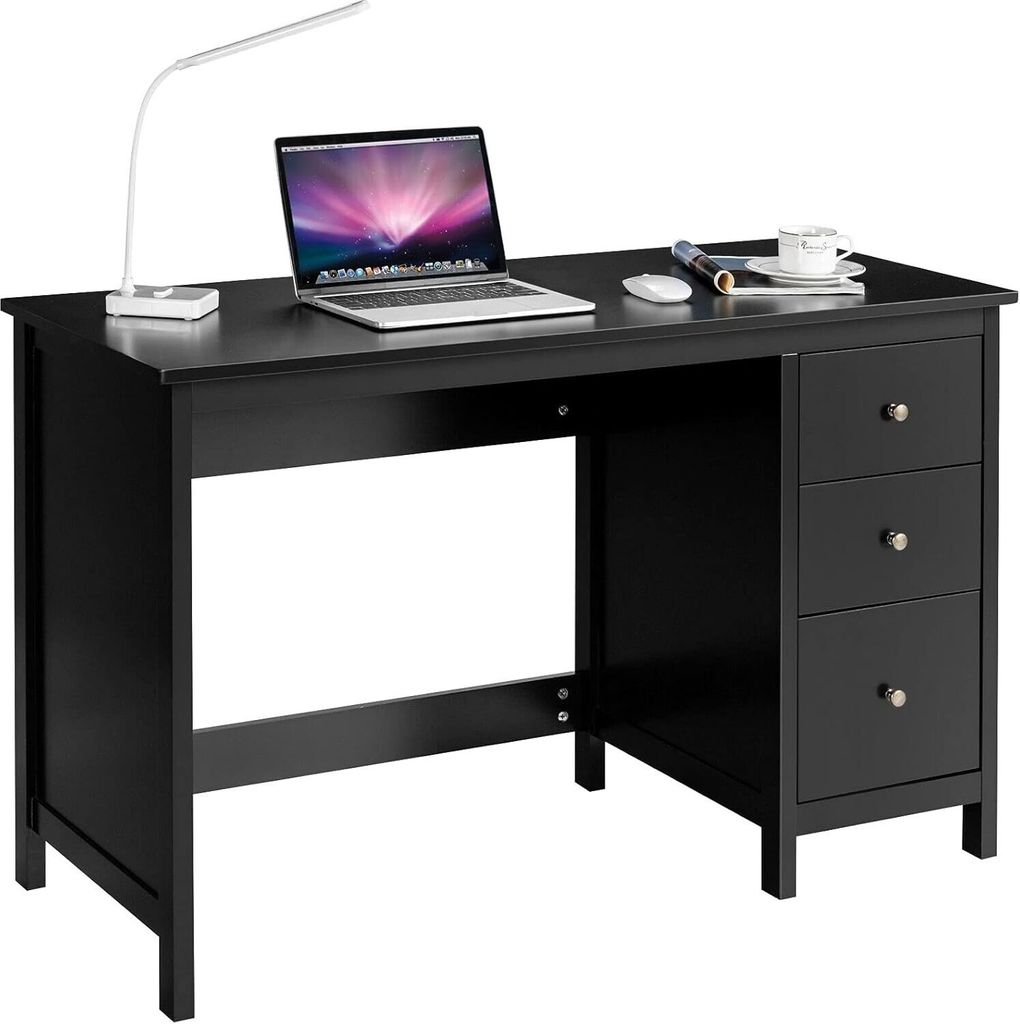 A black wooden desk with a laptop, lamp, mouse, and coffee cup on it.