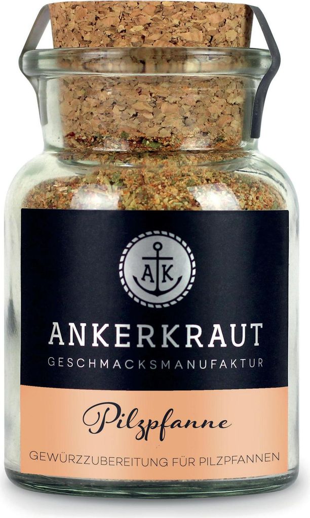 A glass jar of seasoning with a cork lid.