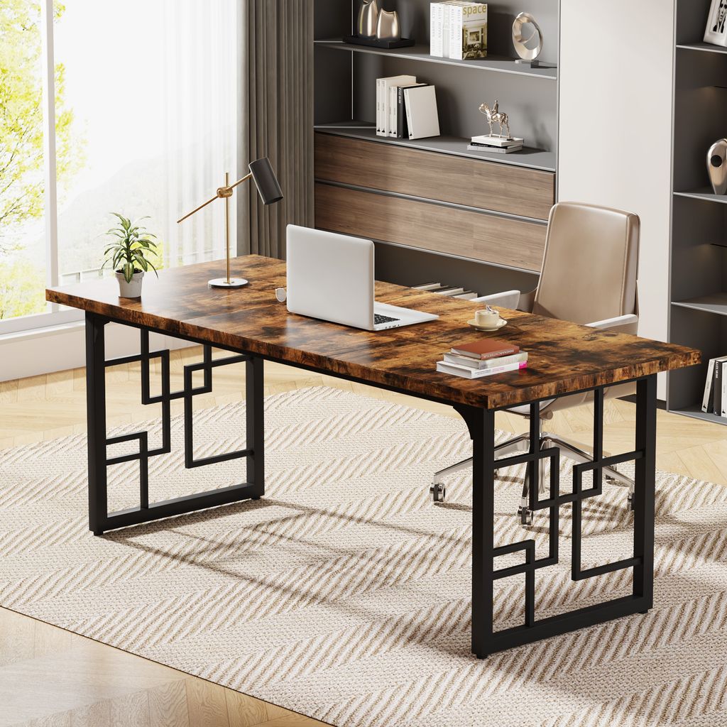 A modern office desk with a laptop, lamp, and plant, set in a well-lit room with a window and bookshelf.