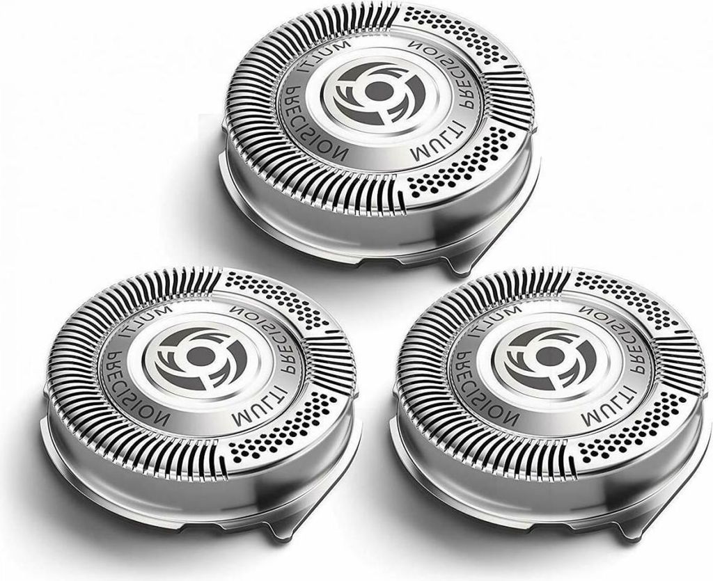 Three replacement shaver heads are arranged in a triangular formation on a white background.