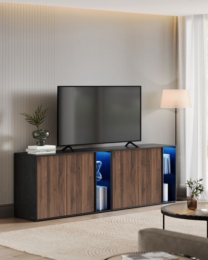 A modern living room with a TV stand and television.
