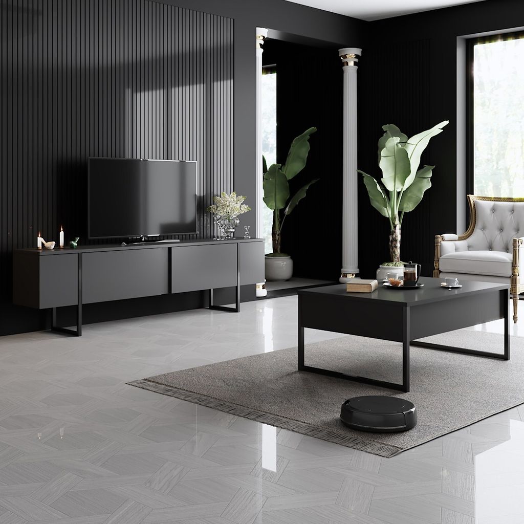 A modern living room with a TV console, coffee table, and plants.