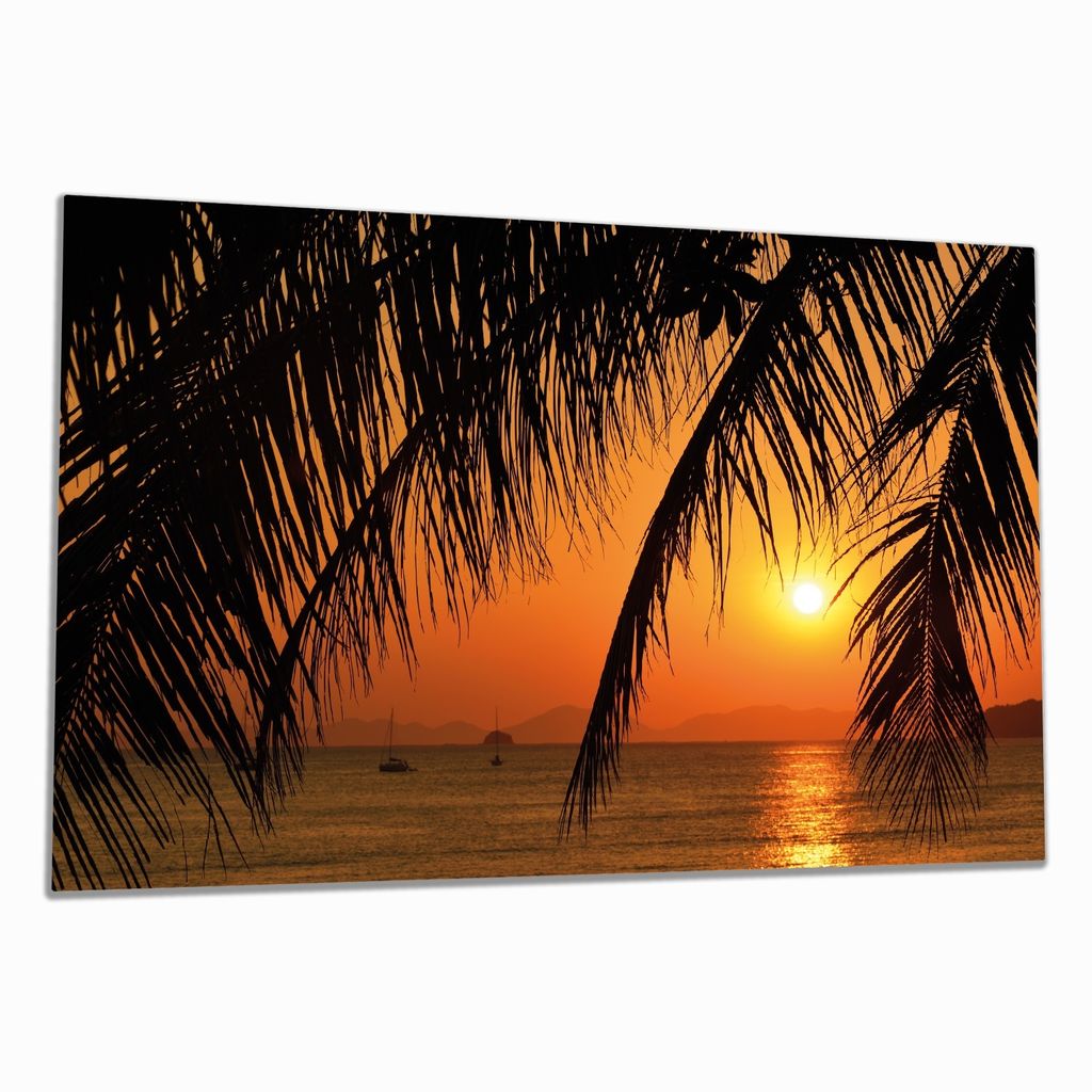 Wallario Herdabdeckplatte aus Glas, Größe 80 x 52 cm 1-teilig, Motiv Sonnenuntergang unter Palmenblättern