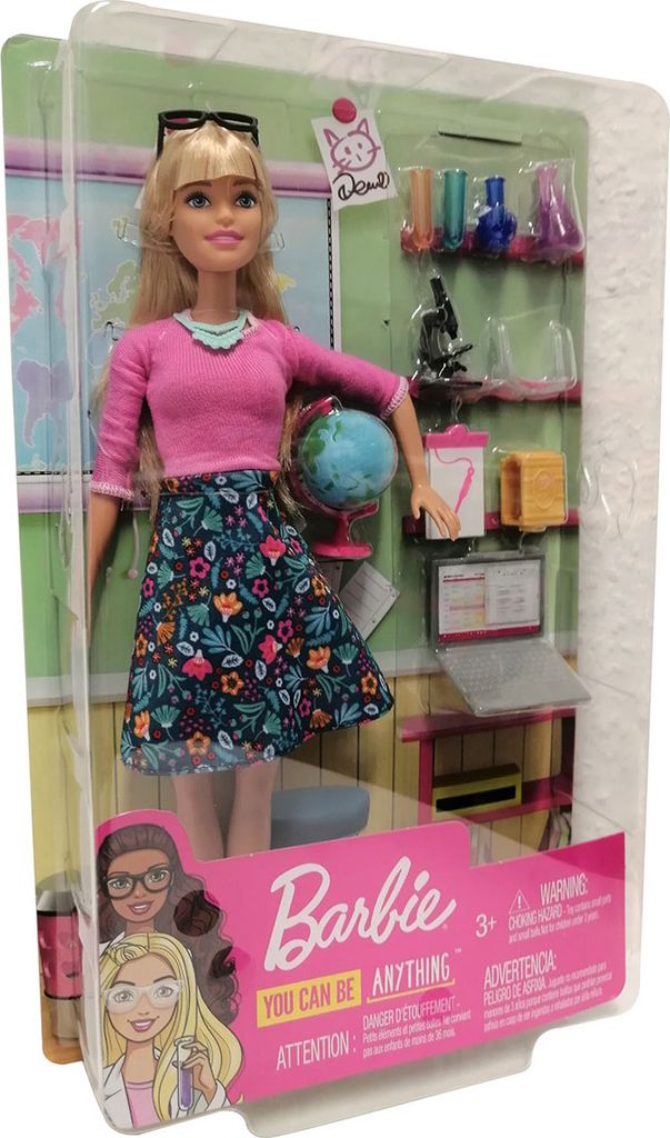 A Barbie doll in its packaging, presented as a science teacher.