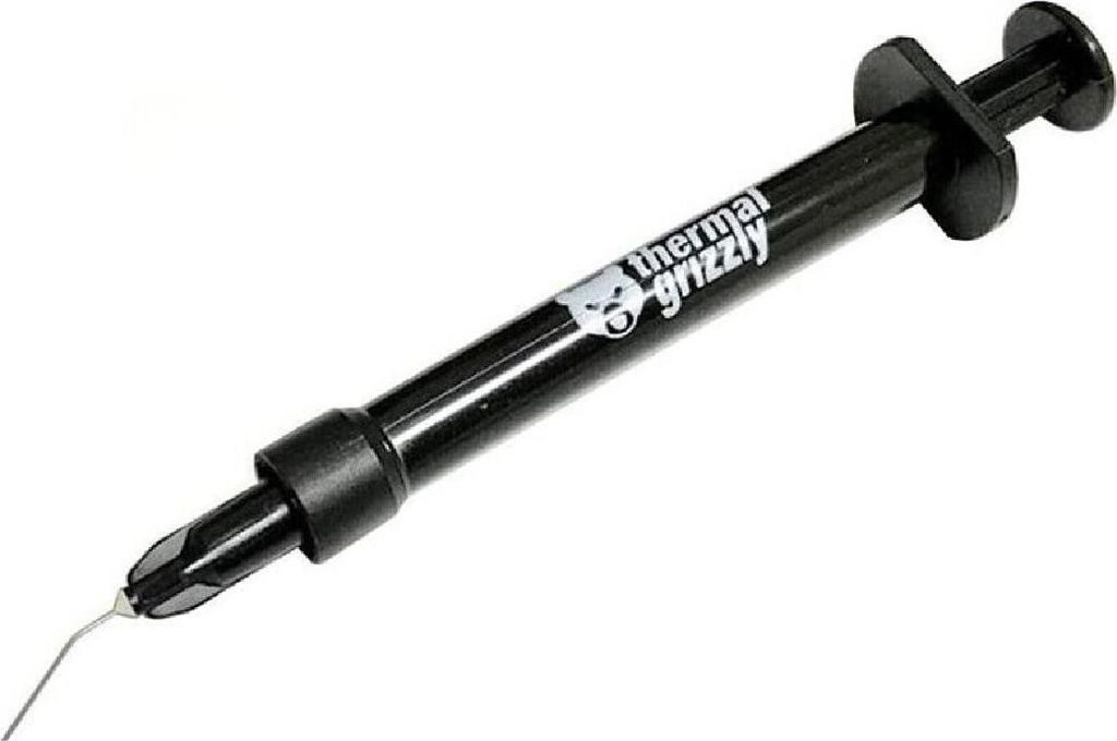 A black syringe of thermal paste on a white background.