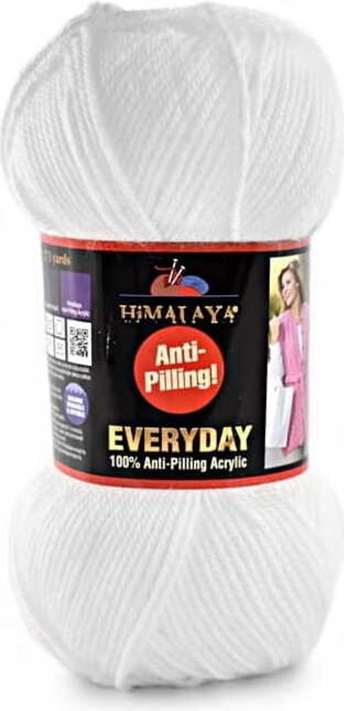 A ball of white yarn with a product label.