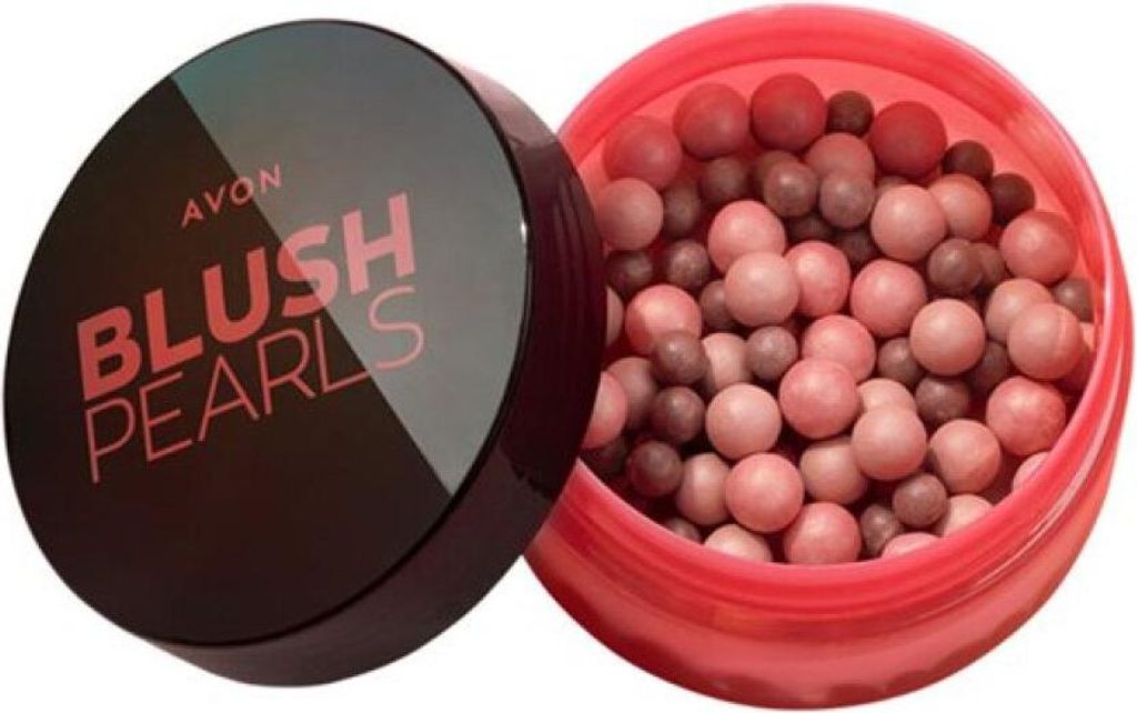 An open container of Avon Blush Pearls with the lid beside it.