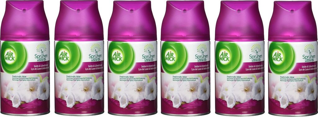 Six cans of Air Wick air freshener are lined up against a white background.
