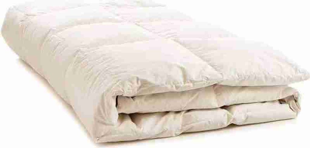 A folded duvet or comforter on a white background.