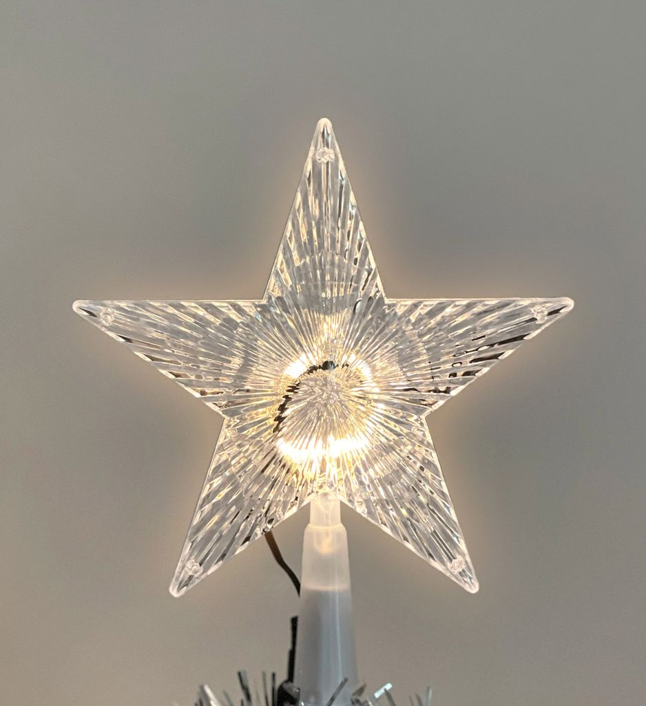 A close-up of a star-shaped Christmas tree topper with integrated LED lights.