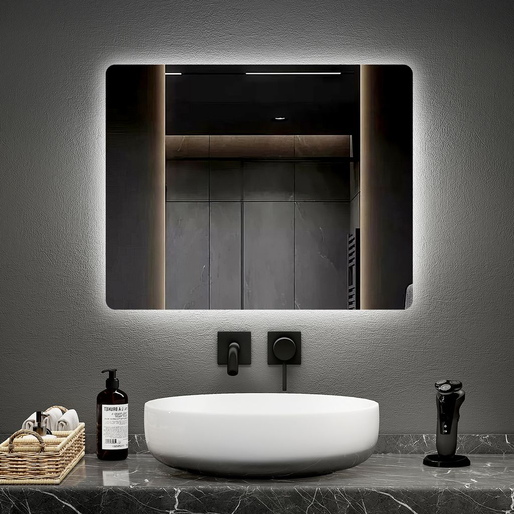 A modern bathroom vanity with a sink, mirror, and accessories.